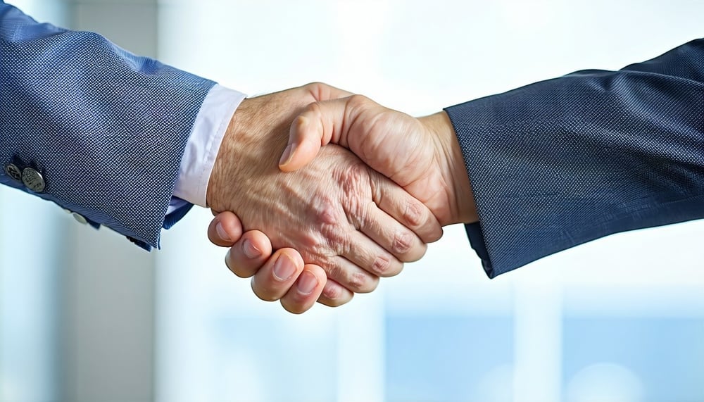 A handshake between business partners symbolizing trust and partnership in wholesaling. A handshake between business partners symbolizing trust and partnership in wholesaling.